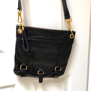 The Sak black leather convertible crossbody/clutch.